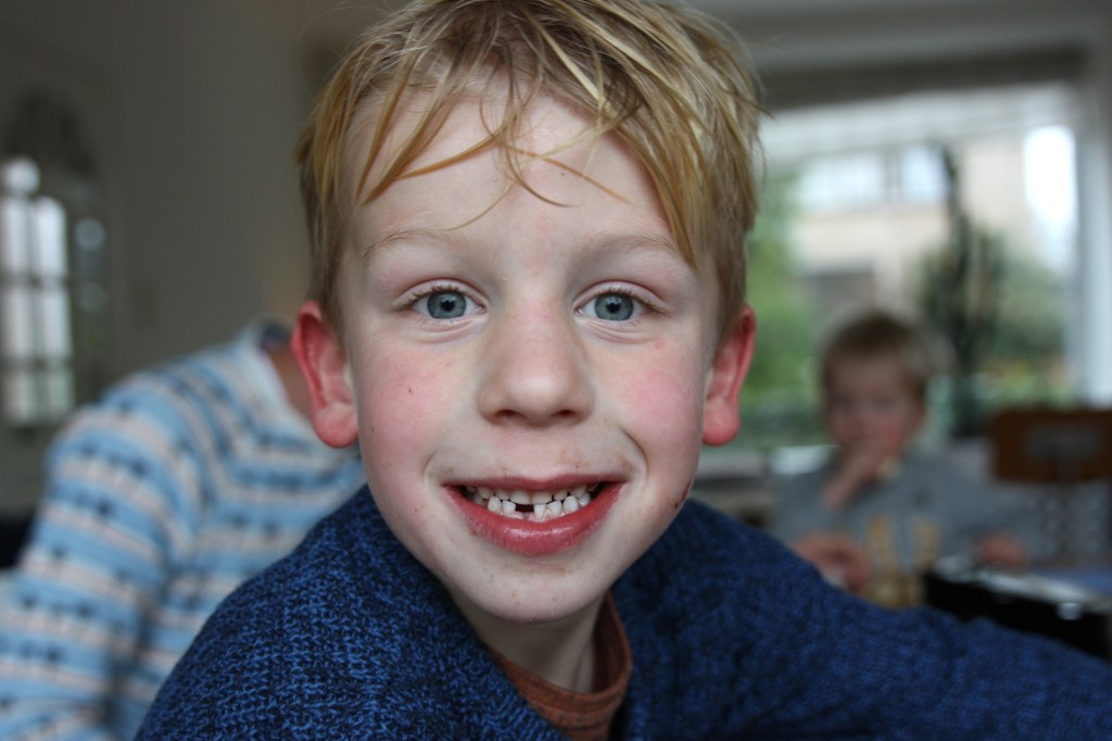 52-49 - lost his first tooth + cycling through the rain